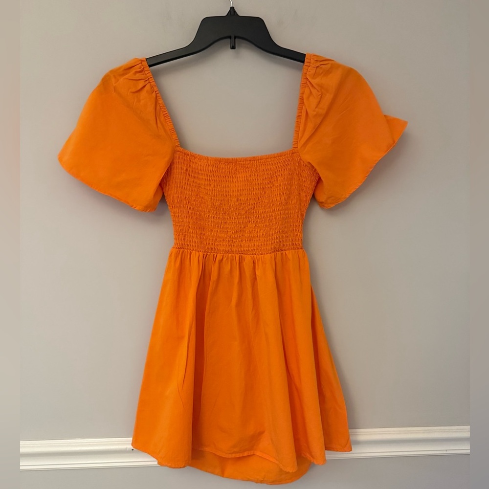 Polly Princess orange smocked chest open back with tie dress. 4